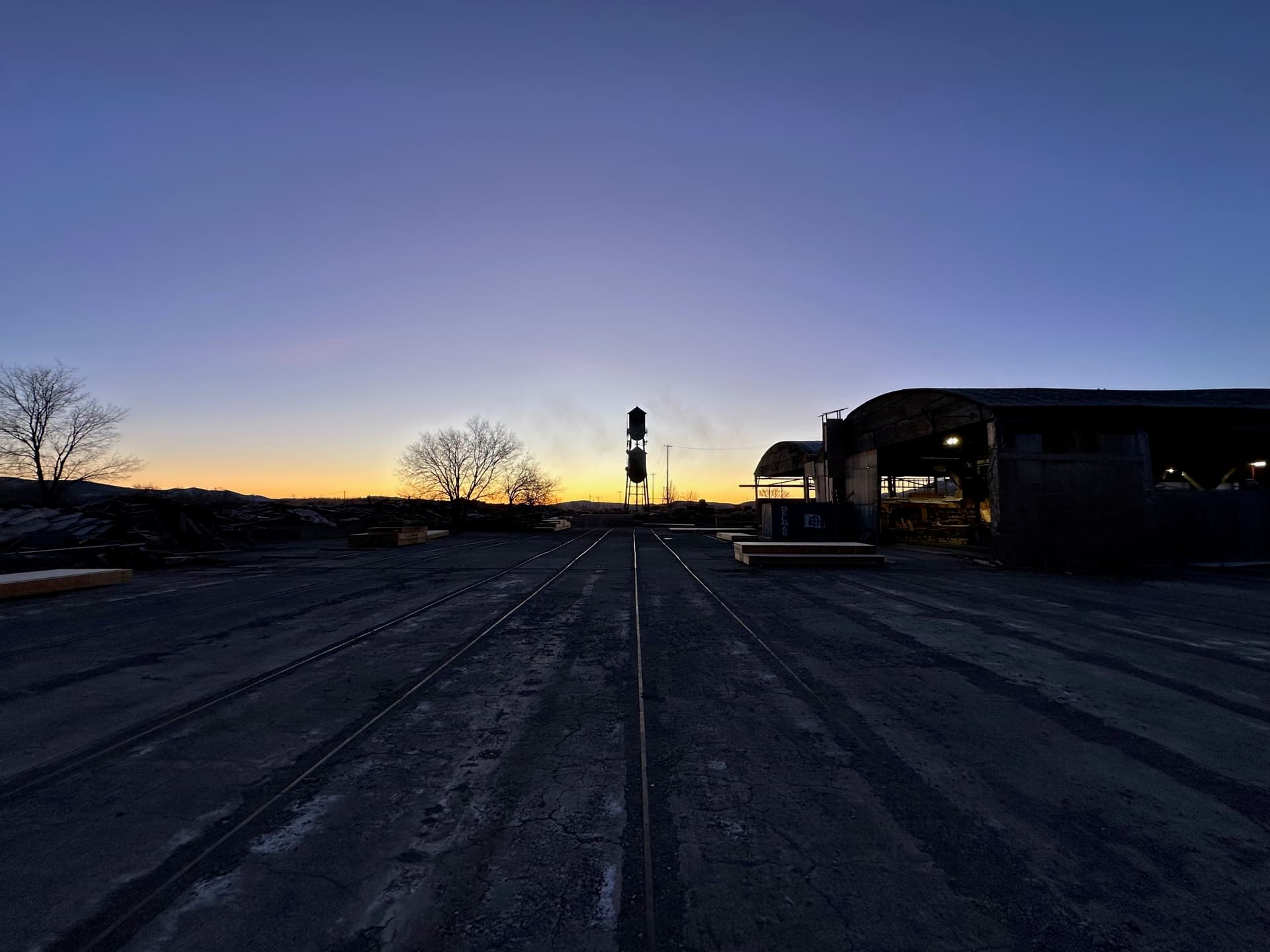 NCC campus at sunset with water tower silhouette