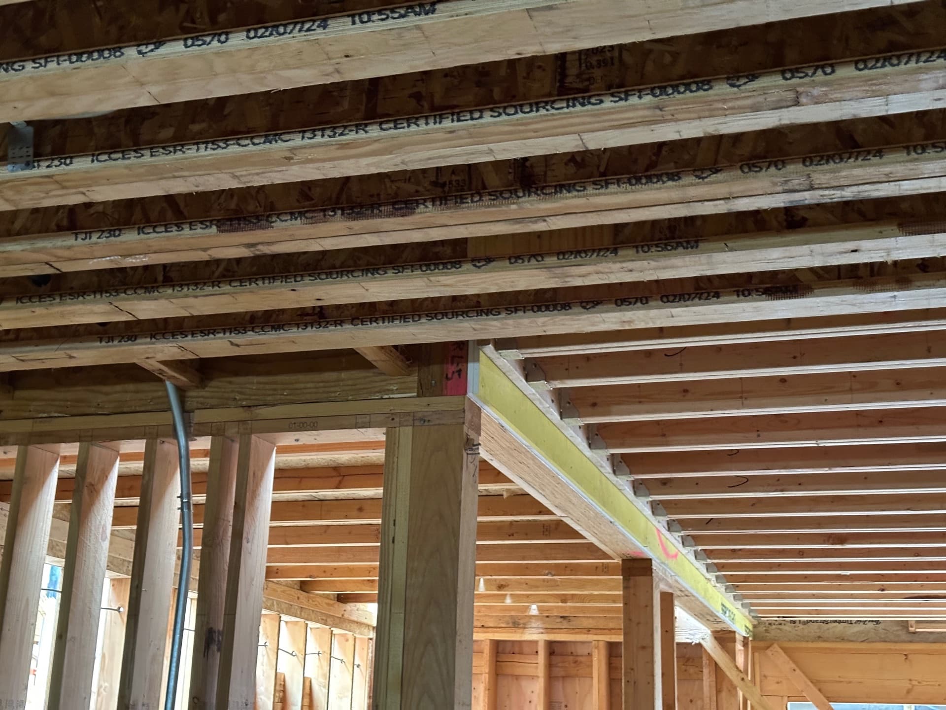 Underside view of installed joists and framing