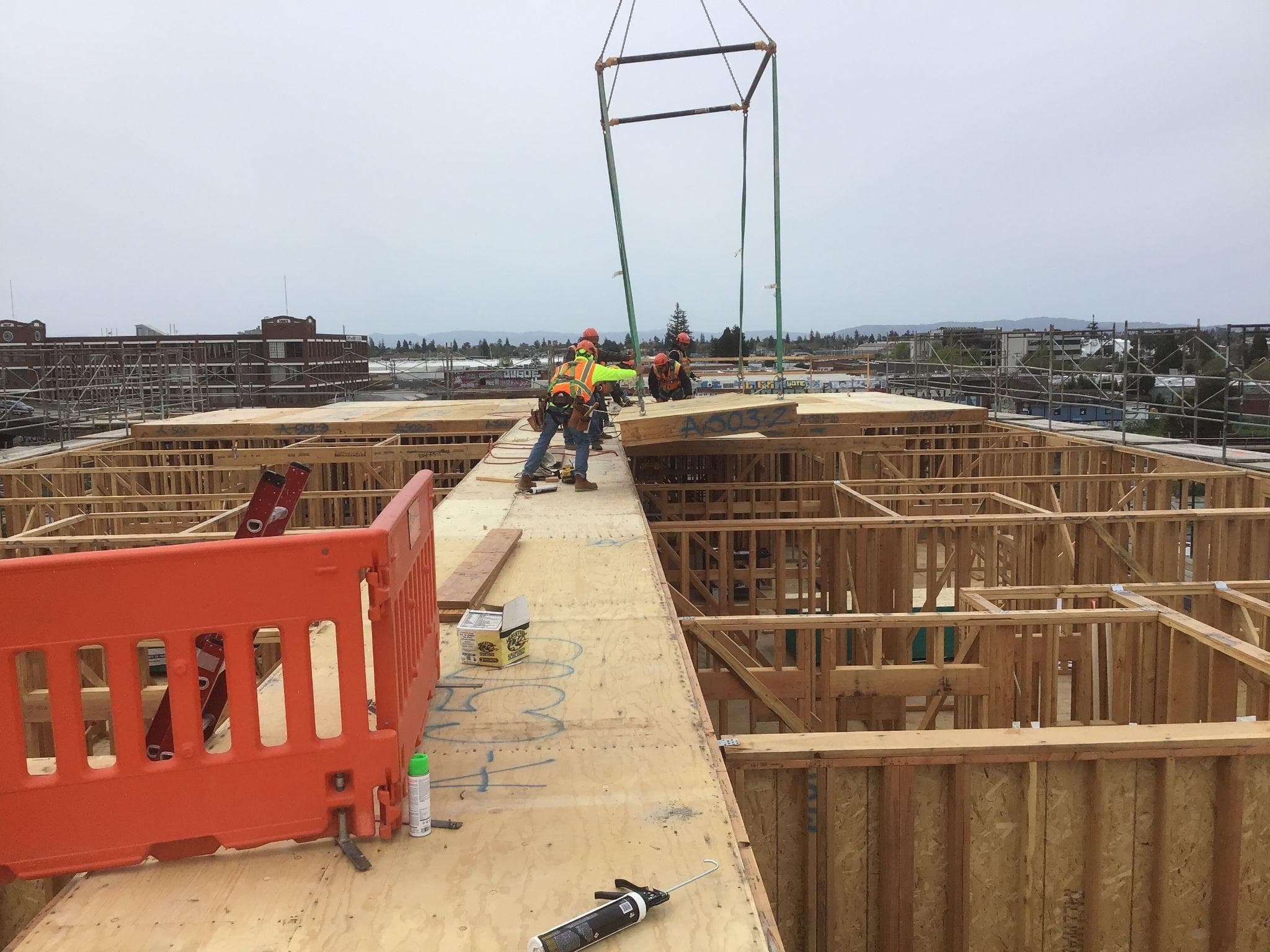 NCC crew members working together installing prefabricated panels