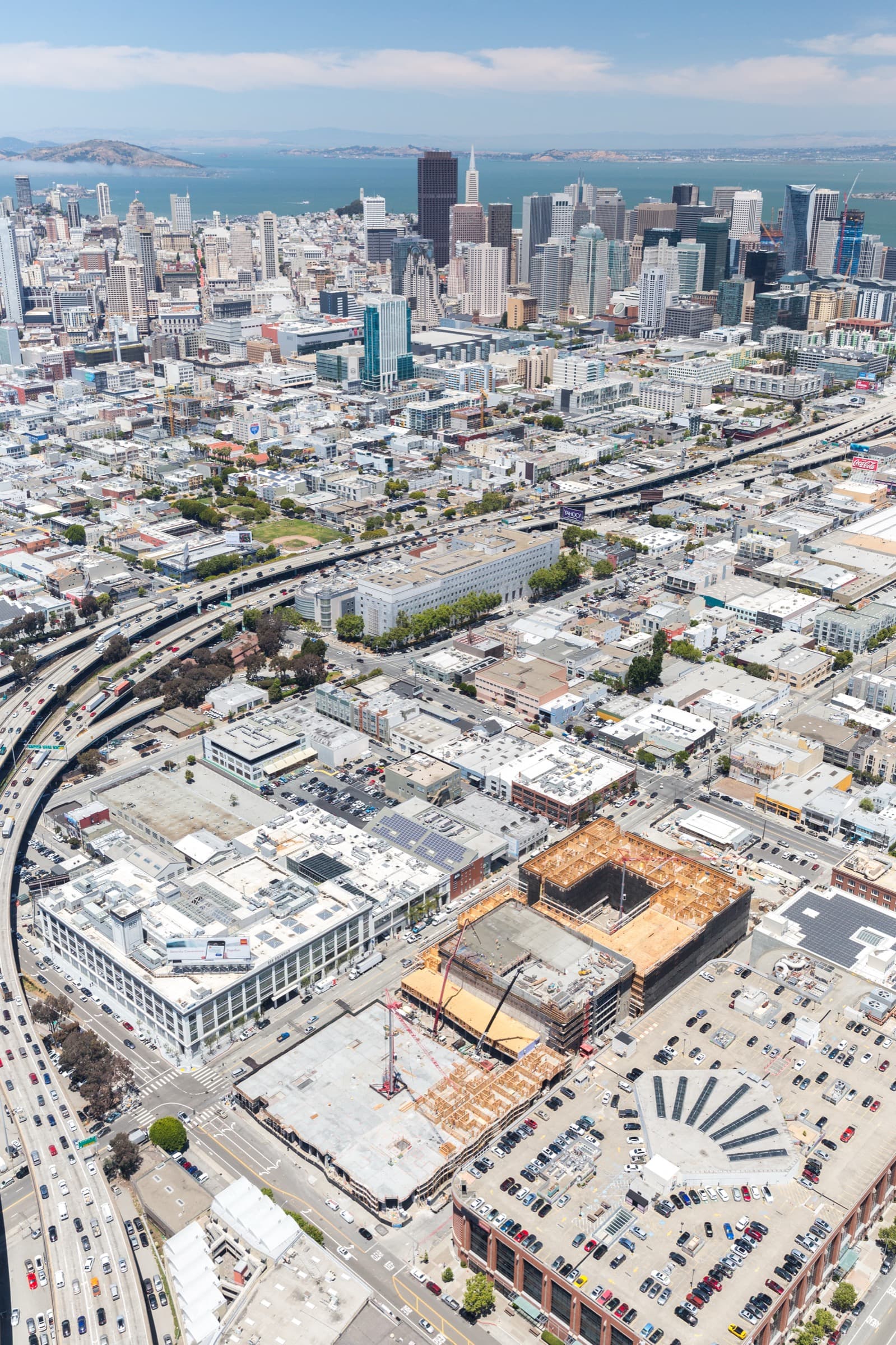 Aerial drone view of NCC construction project with San Francisco skyline