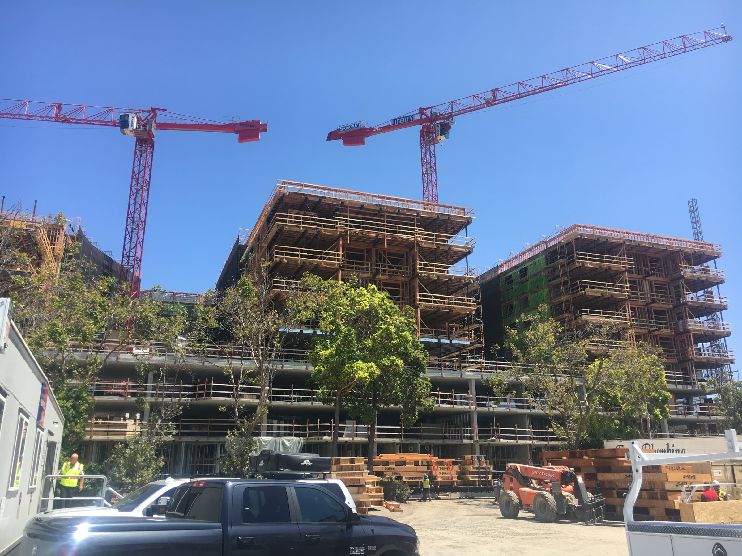 Jack London Square with three red tower cranes